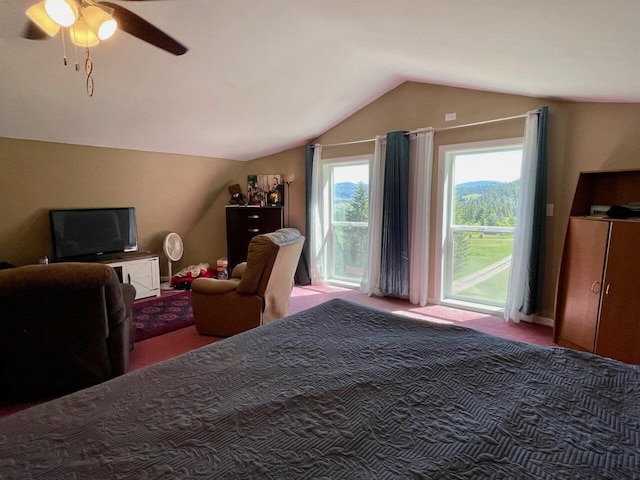 bedroom featuring ceiling fan and lofted ceiling