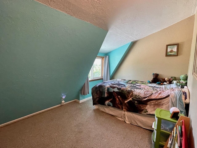 carpeted bedroom with a textured ceiling and lofted ceiling