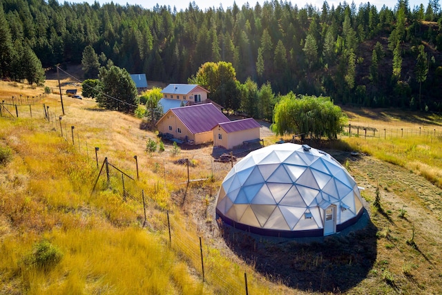 bird's eye view featuring a rural view and a view of trees