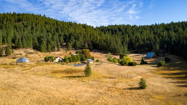 exterior space with a forest view