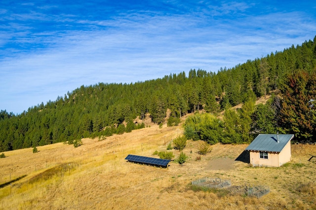 aerial view featuring a wooded view