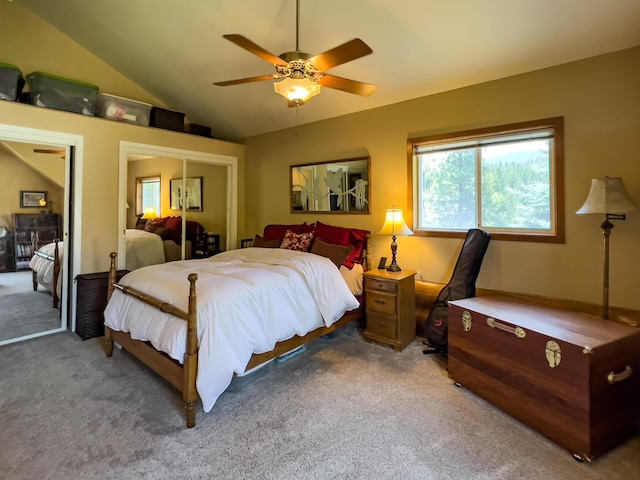 bedroom featuring carpet, a closet, lofted ceiling, and ceiling fan