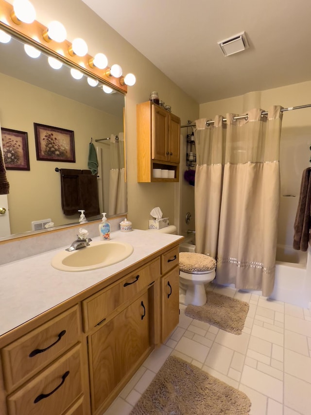 full bathroom featuring vanity, shower / tub combo with curtain, and toilet