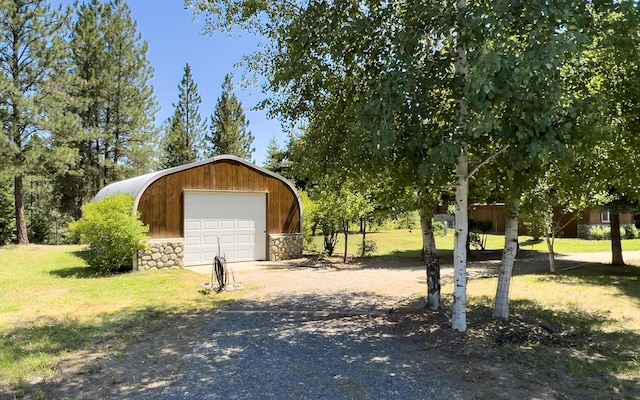 garage with a yard