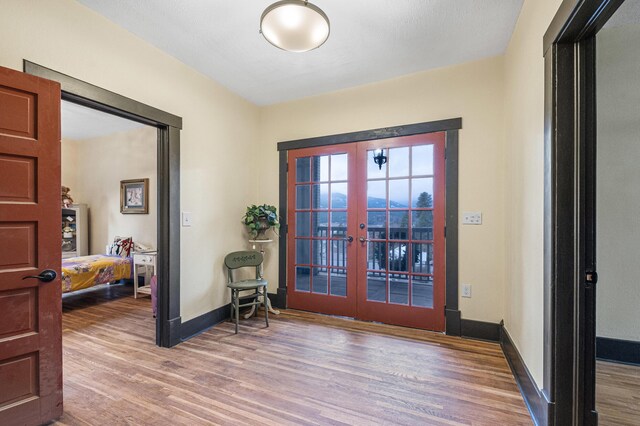 entryway featuring french doors and hardwood / wood-style floors