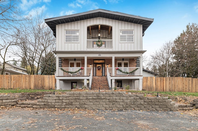 view of front facade with a balcony and a porch