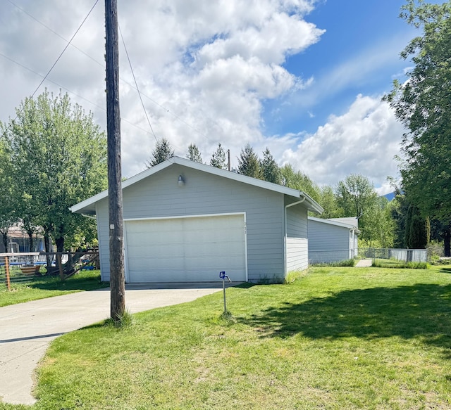 211 8th Ave, Ione, WA 99139 - view of property exterior featuring an outbuilding and a garage