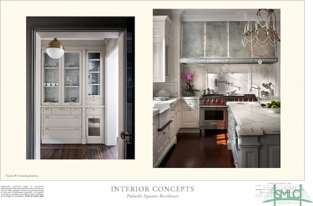 interior space with white cabinets, a chandelier, range with two ovens, dark hardwood / wood-style flooring, and pendant lighting