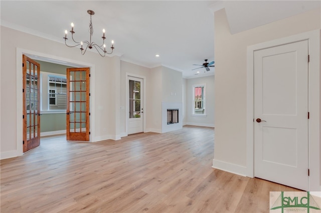 49 Salt Marsh Dr, Midway, GA 31320 - unfurnished living room with french doors, ornamental molding, light wood-type flooring, and ceiling fan with notable chandelier
