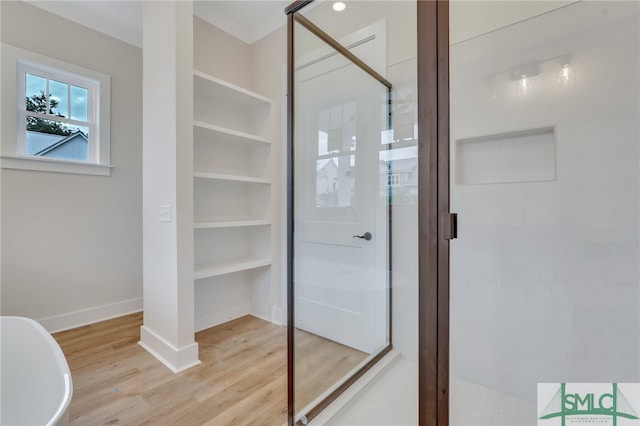 49 Salt Marsh Dr, Midway, GA 31320 - bathroom with an enclosed shower and wood-type flooring
