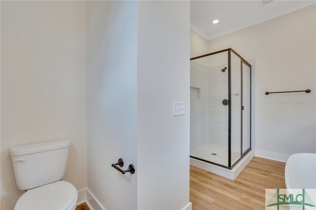 49 Salt Marsh Dr, Midway, GA 31320 - bathroom featuring walk in shower, wood-type flooring, and toilet