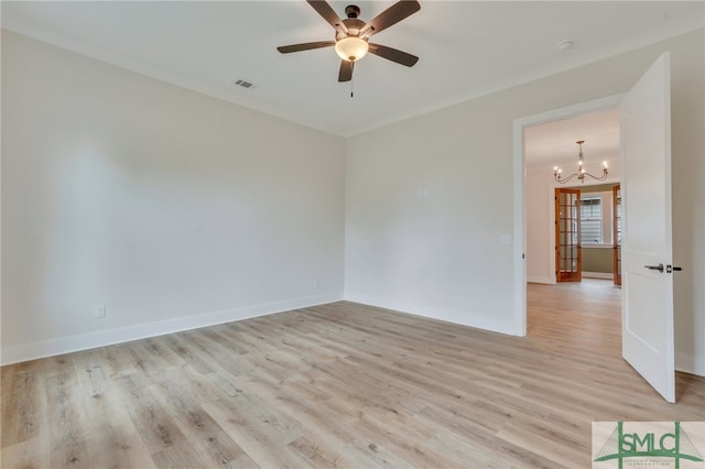 49 Salt Marsh Dr, Midway, GA 31320 - empty room with ornamental molding, light hardwood / wood-style flooring, and ceiling fan with notable chandelier