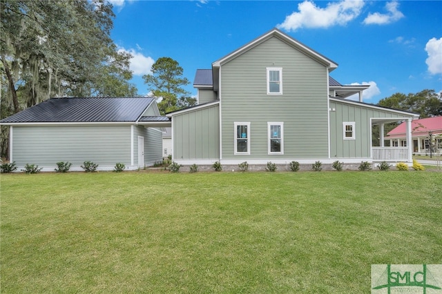 49 Salt Marsh Dr, Midway, GA 31320 - rear view of property featuring a lawn