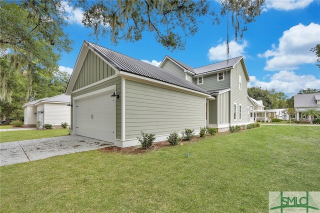 49 Salt Marsh Dr, Midway, GA 31320 - view of property exterior featuring a lawn and a garage