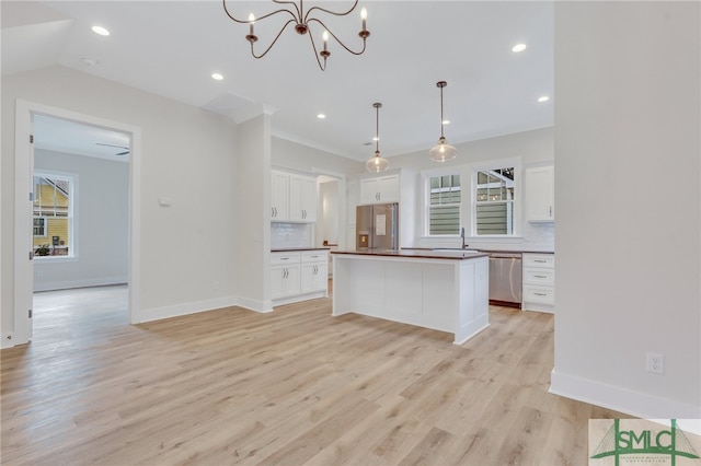 49 Salt Marsh Dr, Midway, GA 31320 - kitchen with backsplash, light wood-type flooring, and stainless steel appliances