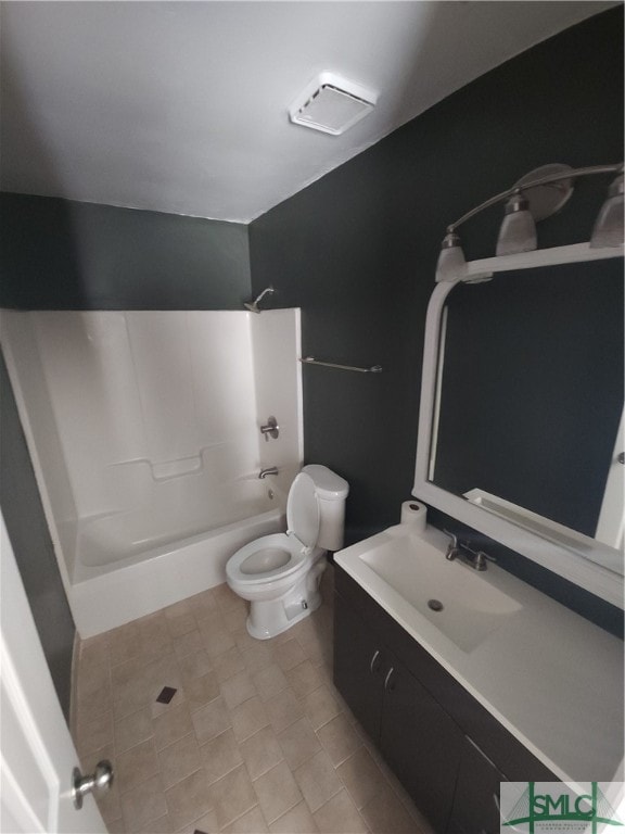 full bathroom featuring vanity, tile floors, shower / washtub combination, and toilet