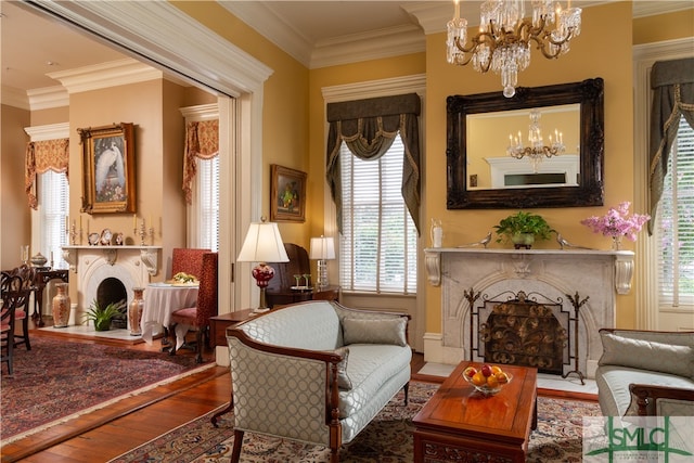 sitting room featuring hardwood / wood-style flooring, ornamental molding, and a wealth of natural light