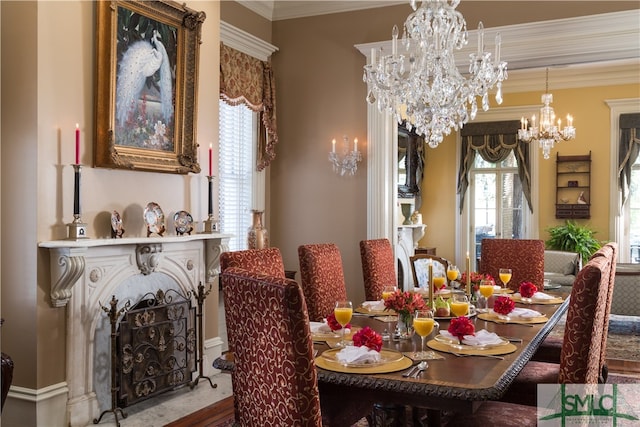 dining space with ornamental molding and an inviting chandelier