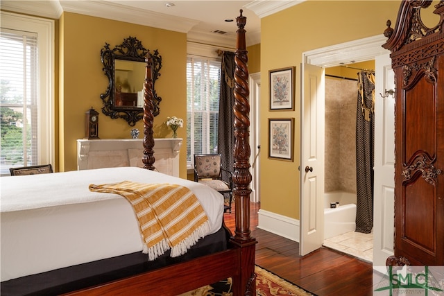 bedroom featuring dark hardwood / wood-style floors, a closet, crown molding, and multiple windows