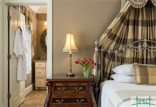 tiled bedroom with ornamental molding