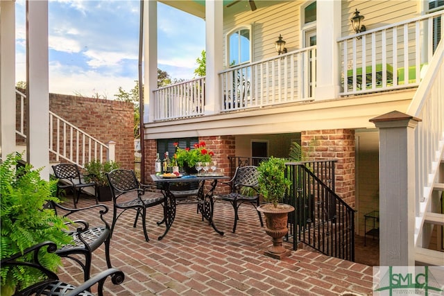 view of patio featuring a balcony