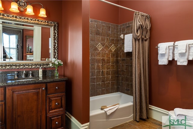 bathroom with tile patterned flooring, shower / bath combination with curtain, and vanity