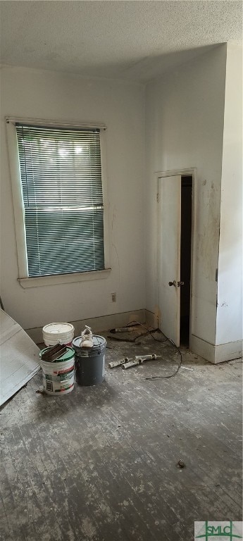 spare room featuring a textured ceiling