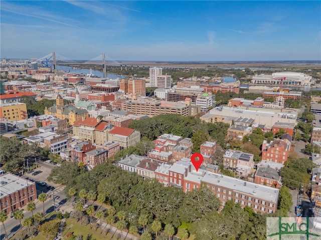 birds eye view of property with a view of city and a water view