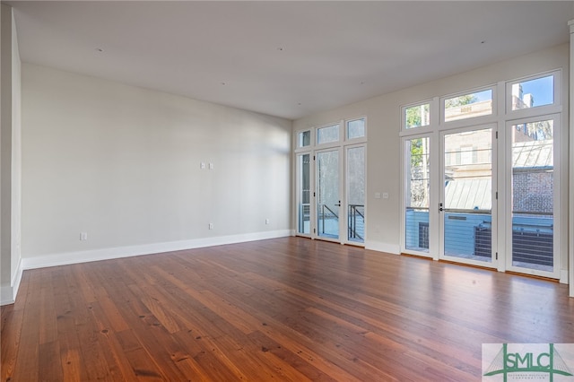 spare room featuring dark hardwood / wood-style flooring