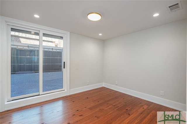 empty room featuring hardwood / wood-style floors