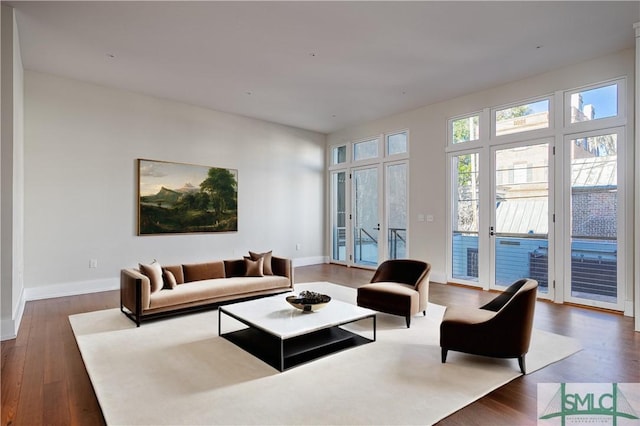 living room with wood finished floors and baseboards