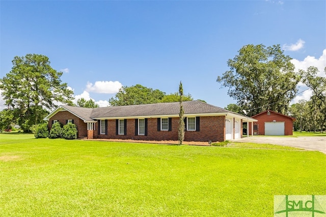 ranch-style home featuring a front yard and a garage