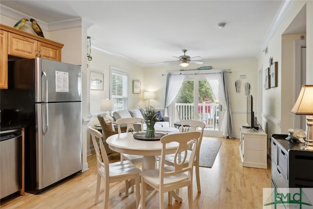 dining room featuring crown molding, ceiling fan, and light hardwood / wood-style flooring