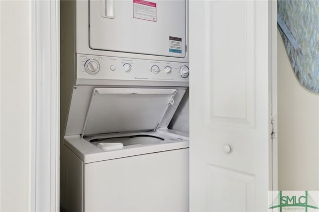 washroom with stacked washer and dryer