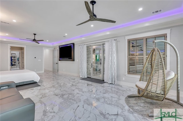 tiled bedroom with ceiling fan, access to outside, and a tray ceiling