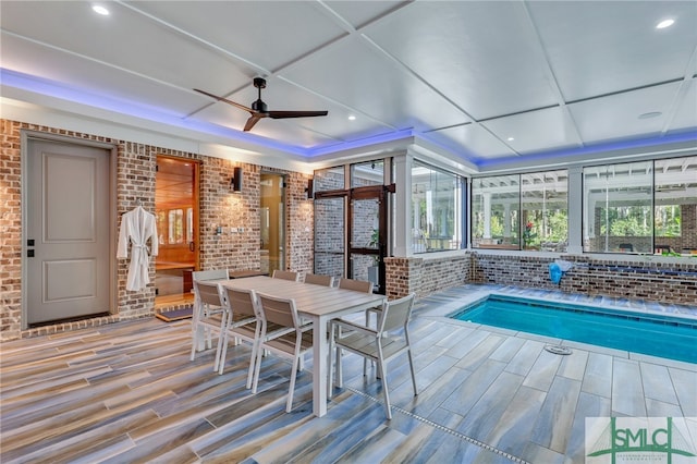 view of swimming pool featuring ceiling fan