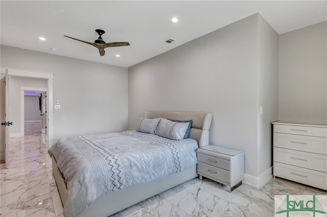 tiled bedroom featuring ceiling fan