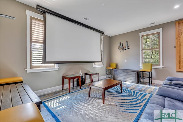 cinema room featuring light hardwood / wood-style floors