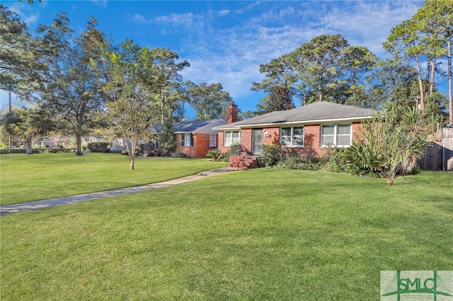 single story home with a front yard