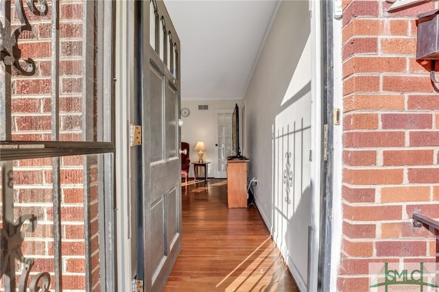 corridor featuring dark hardwood / wood-style floors