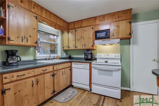 116 E 66th St, Savannah, GA 31405 - kitchen featuring light hardwood / wood-style floors, white appliances, and sink