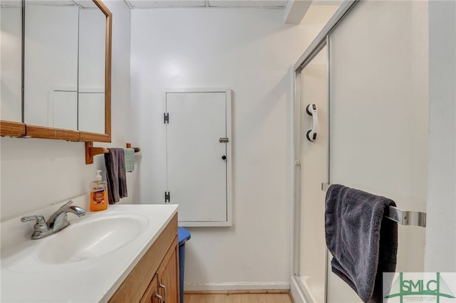 116 E 66th St, Savannah, GA 31405 - bathroom featuring vanity with extensive cabinet space and hardwood / wood-style flooring