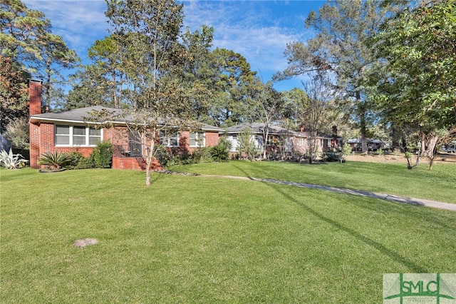 116 E 66th St, Savannah, GA 31405 - view of front of house with a front lawn