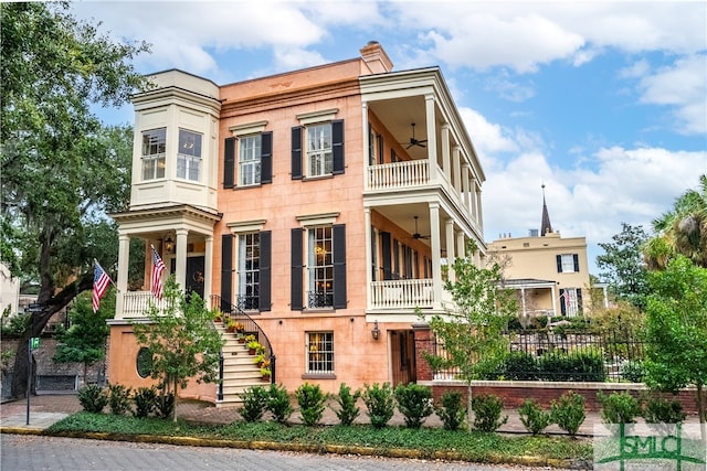 view of front of house featuring a balcony