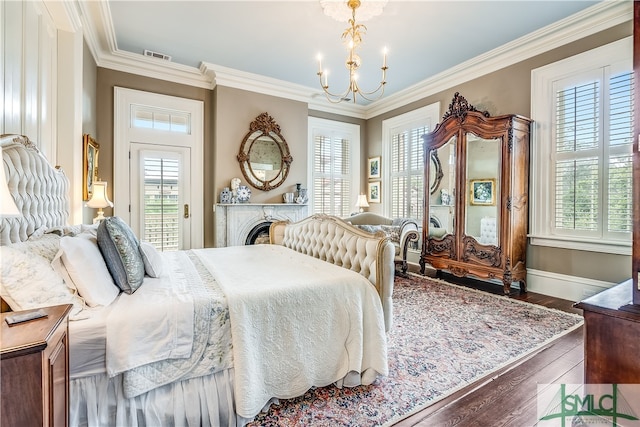 bedroom with crown molding, multiple windows, and hardwood / wood-style floors