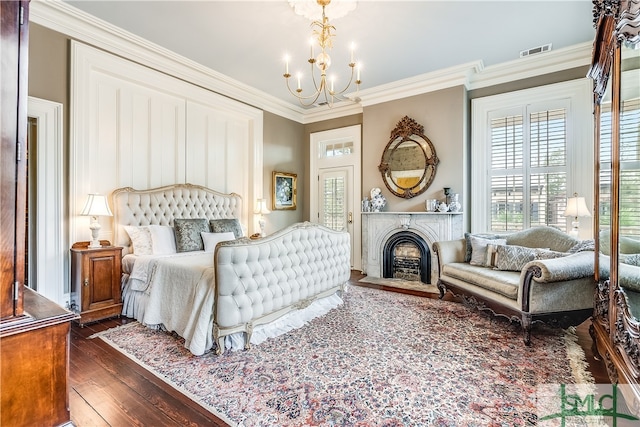 bedroom with dark wood-type flooring, a chandelier, and crown molding