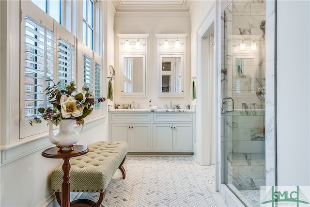 bathroom with vanity with extensive cabinet space, tile floors, ornamental molding, walk in shower, and double sink