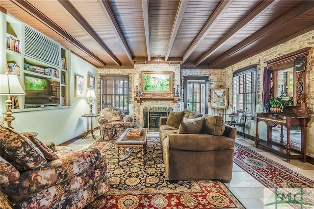 living room featuring beamed ceiling, tile flooring, a fireplace, and wood ceiling