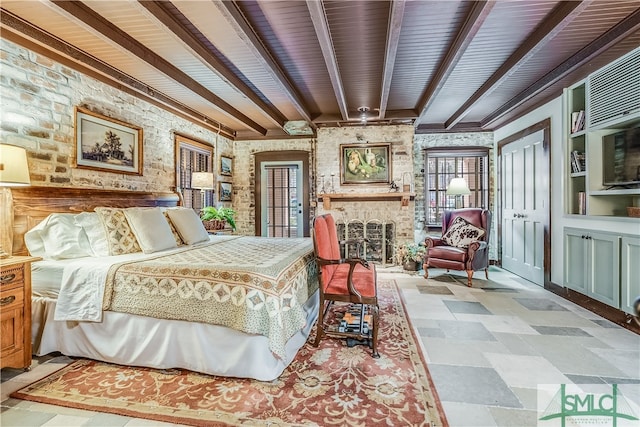 bedroom with wooden ceiling, beam ceiling, tile floors, and a fireplace