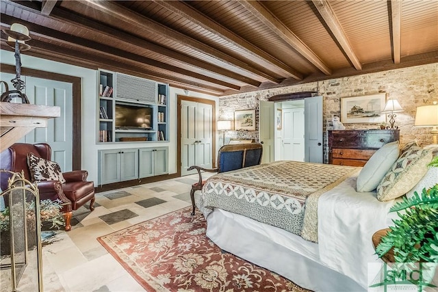 bedroom featuring beamed ceiling, wooden ceiling, and tile patterned floors